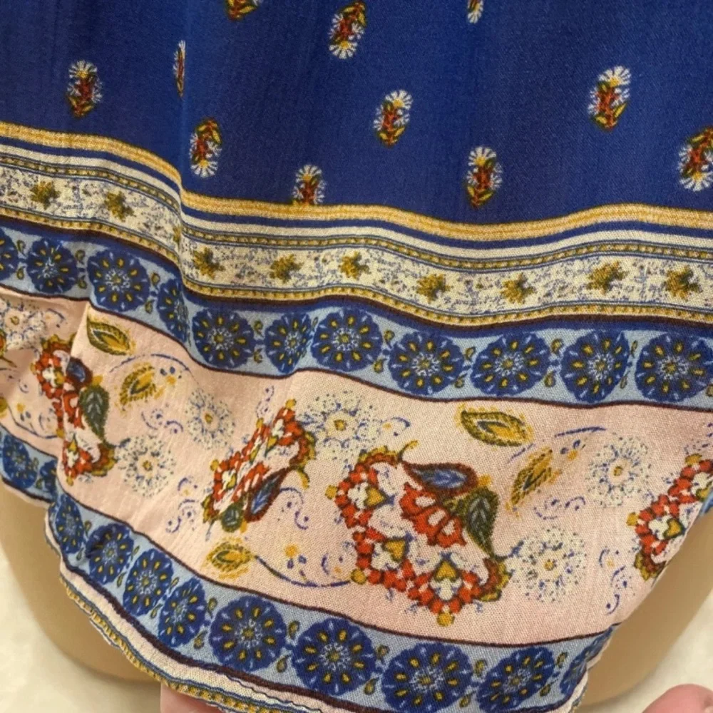 Rewind Royal Blue Sleeveless Floral Blouse with Patterned Hem